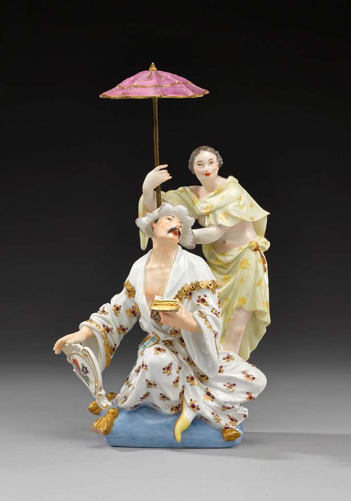 A group of figures of a Japanese couple